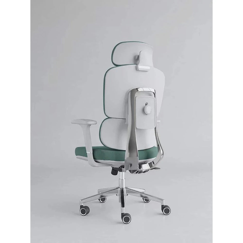 Neva Axis green chair from behind, showing the light-coloured back shell, polished support frame and rear knob
