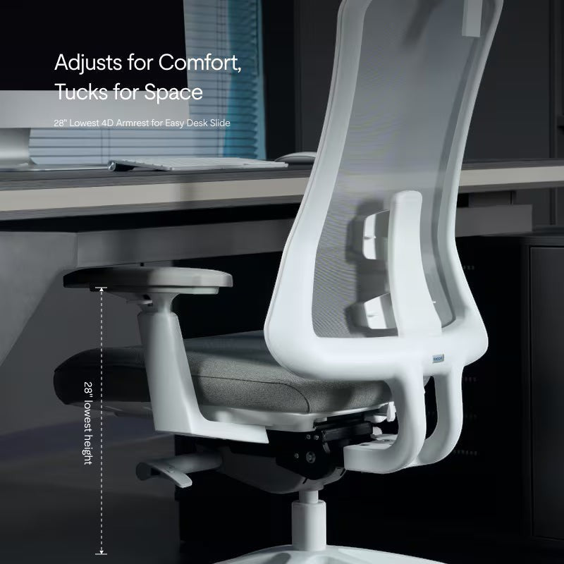 Neva Furniture Sheer ergonomic office chair in white with gray mesh back and adjustable armrests, shown under a desk.