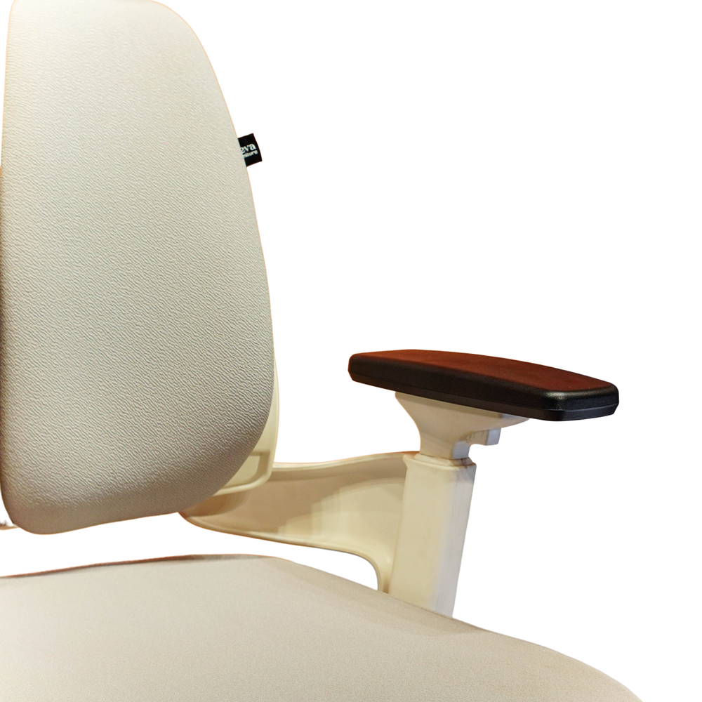 Neva Prime White chair close-up of the padded backrest, black armrest pad and white armrest support.