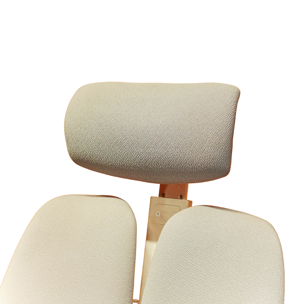Neva Prime White chair padded headrest and upper split backrest, close-up of the original upholstery.
