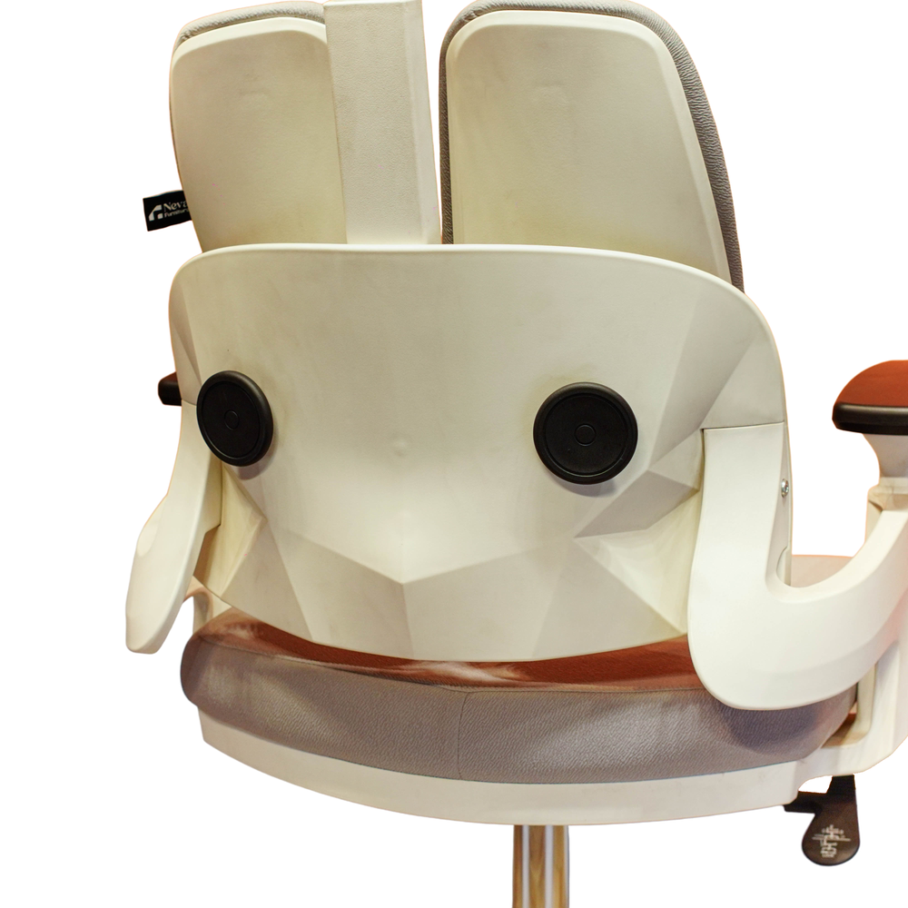 Neva Prime White chair rear back-support close-up showing the faceted white shell and original seat upholstery.