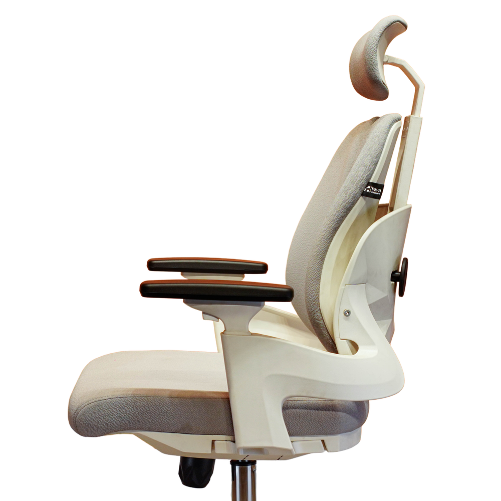 Neva Prime White chair side-profile detail showing the headrest, backrest, armrests, seat and under-seat controls.