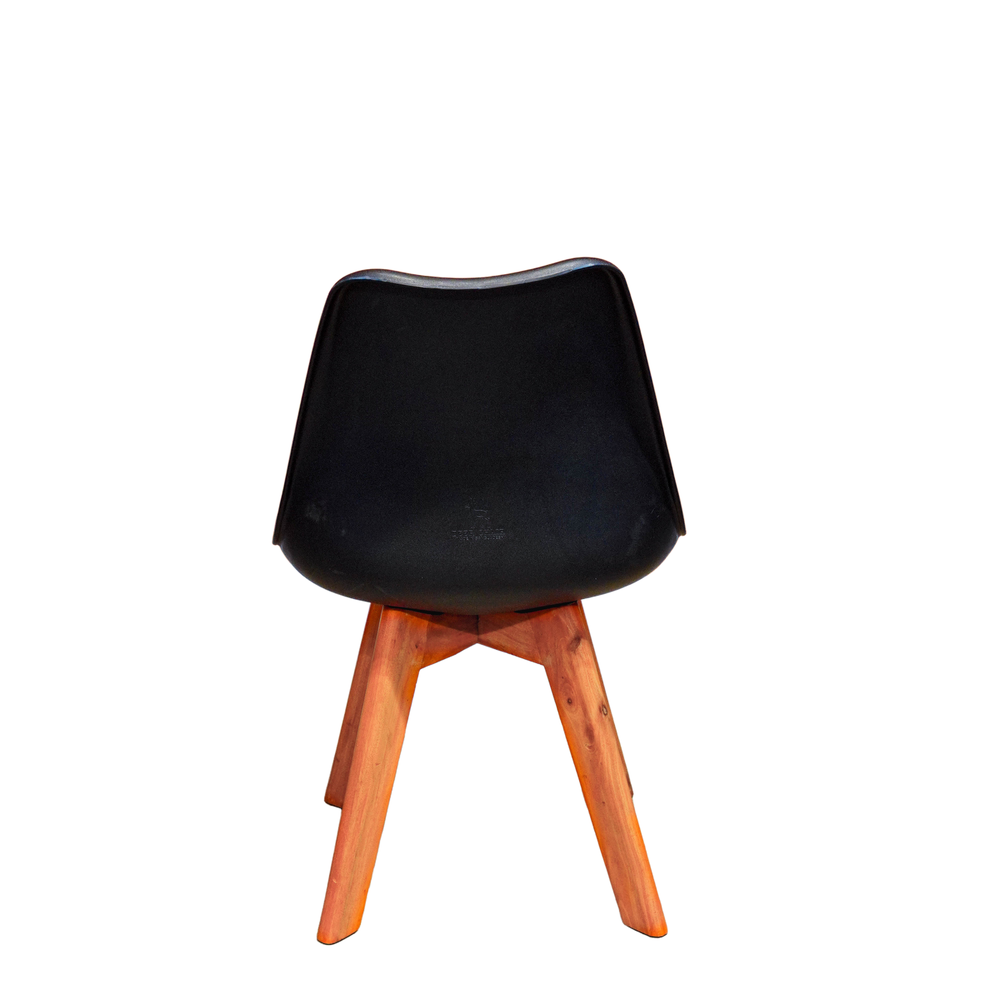 Neva Tulip Black shell chair, rear view showing the smooth plastic back, wooden joins and four tapered legs