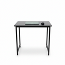 Black desk with a computer monitor and mouse on a white background