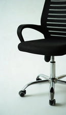 Neva Furniture black mesh office chair with ergonomic support and chrome base with casters.