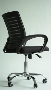 Neva Furniture black mesh office chair with ergonomic support and cushioned seat, on a chrome base with casters.