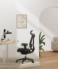 Neva Furniture BS14 ergonomic office chair in black mesh with adjustable lumbar support and headrest.