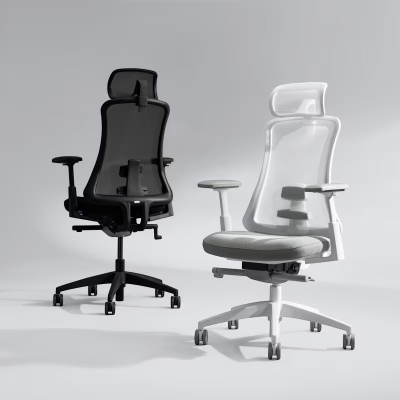 Neva Furniture Sheer ergonomic office chairs in black and white with mesh backs and adjustable armrests. Ideal for home or office.