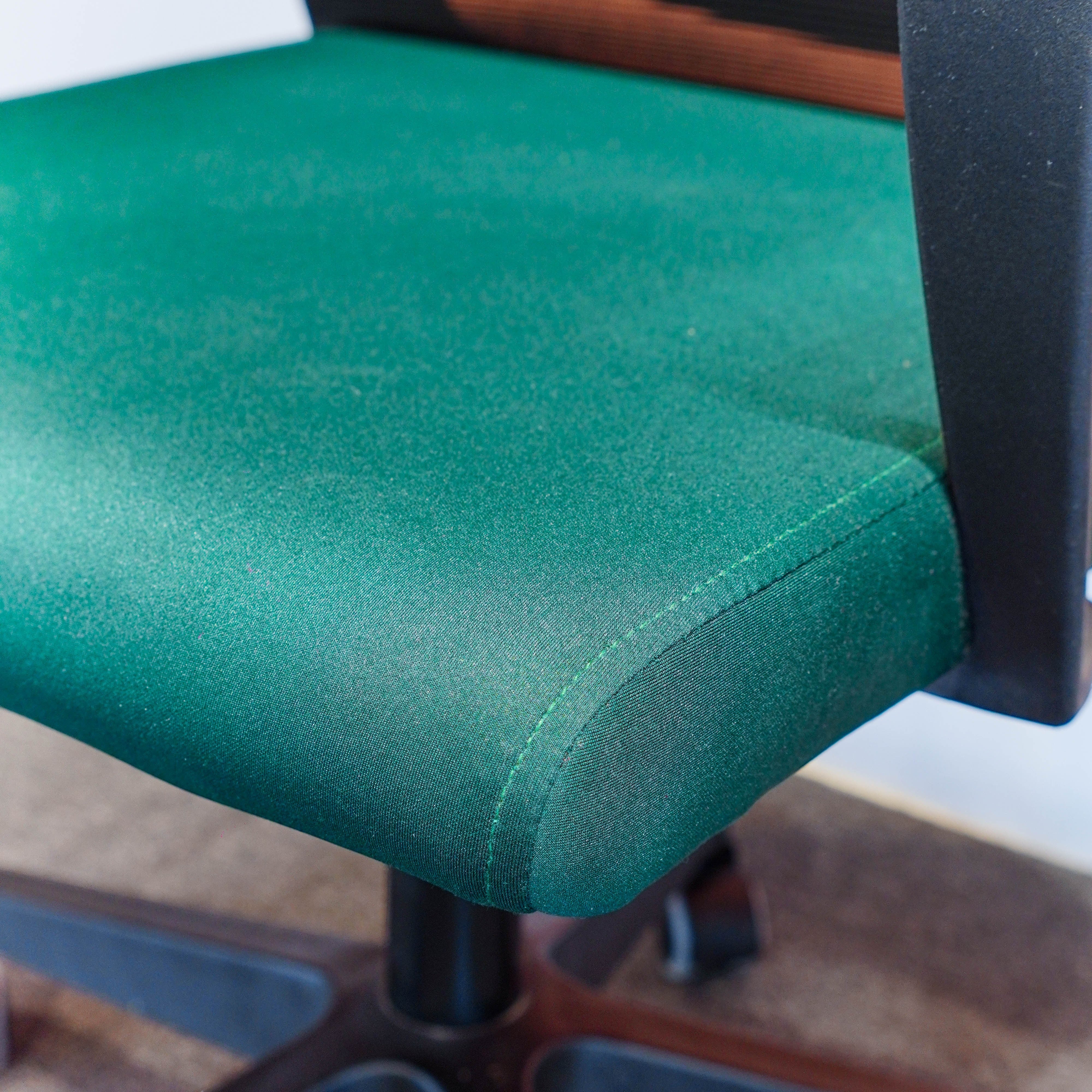 Neva Furniture Vibe Chair in emerald green fabric with cushioned seat and breathable mesh back. Ergonomic office chair with adjustable height and tilt lock.