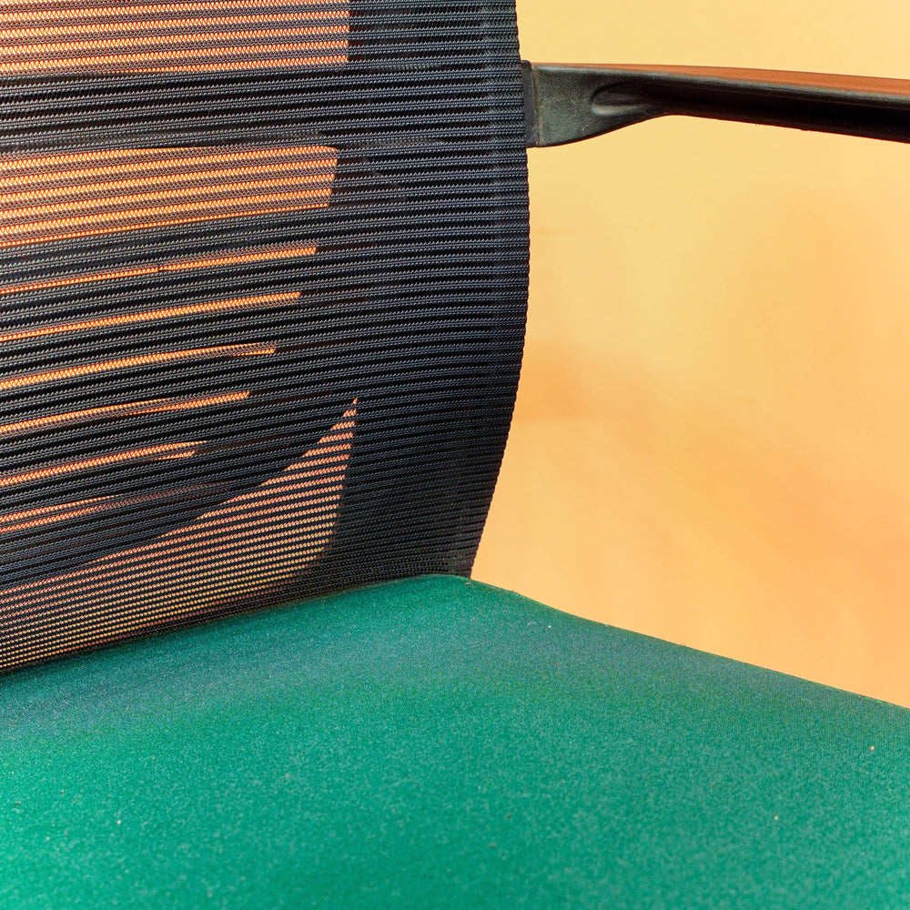 Neva Furniture Vibe Chair with black mesh back and green cushioned seat, ideal for home office.