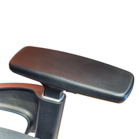 Neva Prestige Black chair textured arm pad, silver-colored collar and black support, photographed from above.