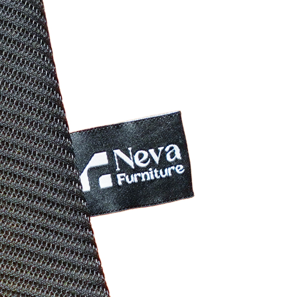 Neva Furniture fabric label and stitched mesh backrest edge on the Prestige Black office chair.