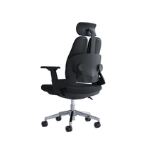 Neva Prime ergonomic office chair in Black, rear three-quarter view showing the back support and chrome base.