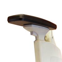 Neva Prime White chair armrest close-up showing the black pad and white support.