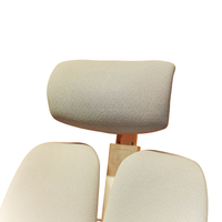 Neva Prime White chair padded headrest and upper split backrest, close-up of the original upholstery.