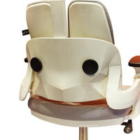 Neva Prime White chair rear back-support close-up showing the faceted white shell and original seat upholstery.