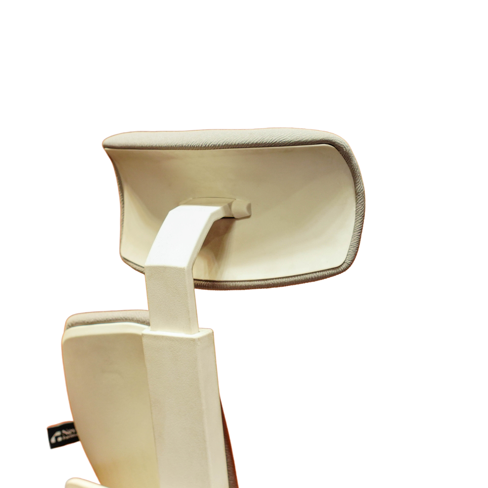 Neva Prime White chair rear headrest close-up showing the upholstery edge, shell and support.