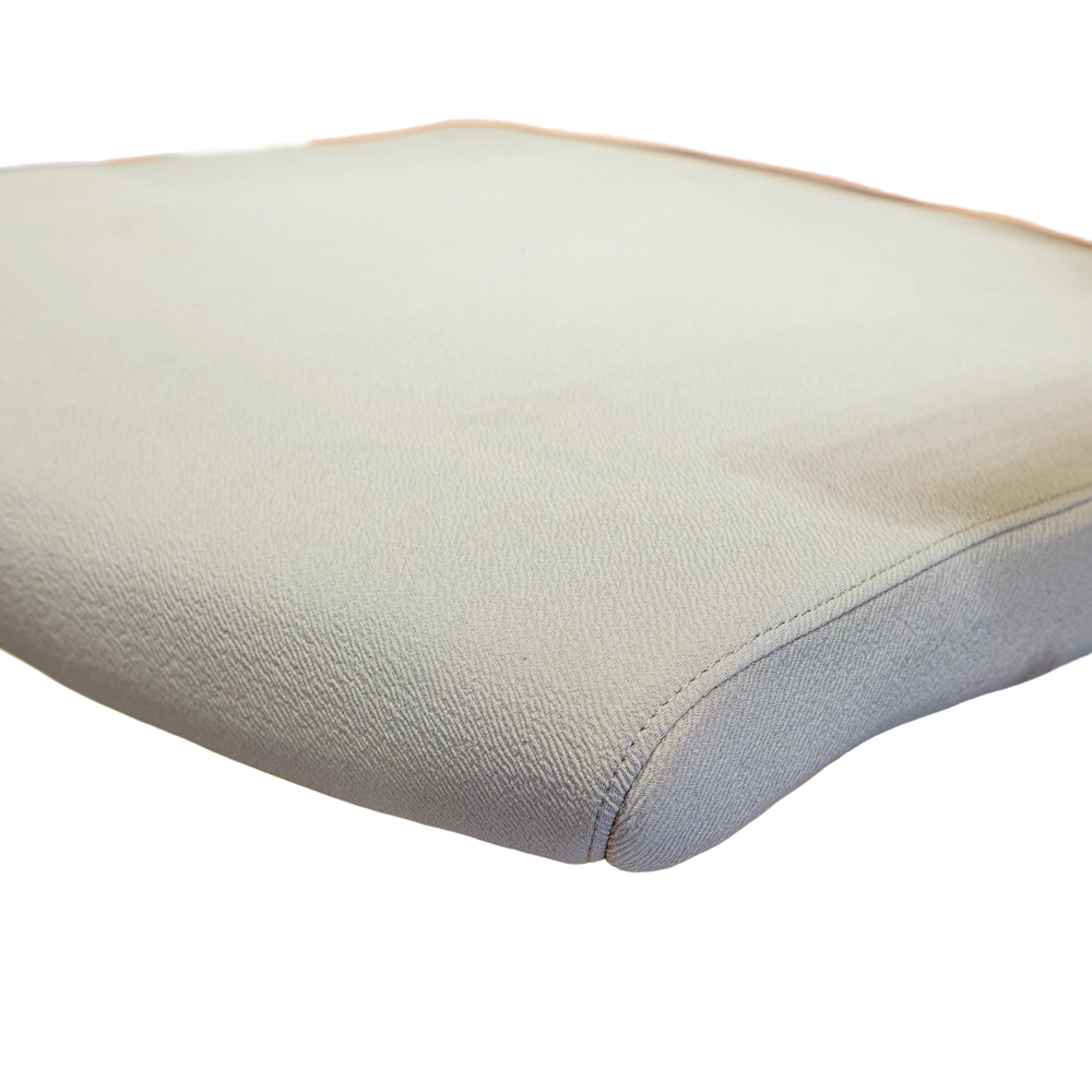 Neva Prime White chair seat cushion close-up showing the upholstery texture and stitched front edge.