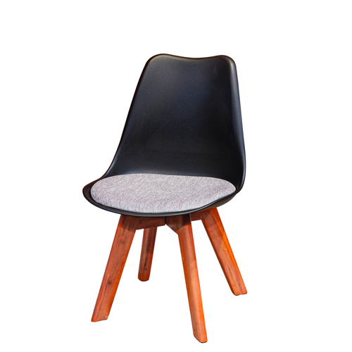 Neva Tulip Black shell chair with a pale woven cushion and four tapered wooden legs, front three-quarter view