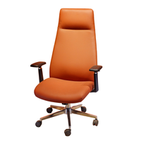 Neva Vero tan-brown executive office chair photographed from the opposite front three-quarter angle, with black arm supports and chrome base.